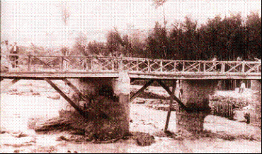 El puente en la estación en 1844. Este puente ha sido derribado más de una vez por las riadas.